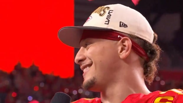 Patrick Mahomes smiles at CBS’s Jim Nantz as the Kansas City Chiefs receive the Lombardi Trophy for winning Super Bowl LVIII on Feb. 11, 2024.